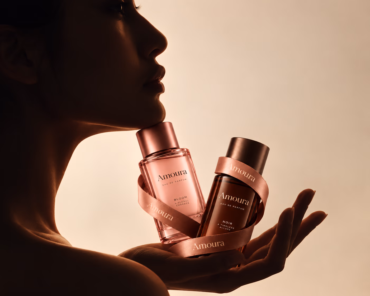 A woman holding two Amoura bottles to her face